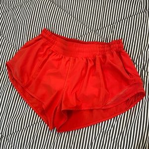 Gently used size 8 orange lululemon 2.5 inch inseam hotty hot shorts